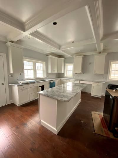 Kitchen remodel in progress with new cabinetry and countertops