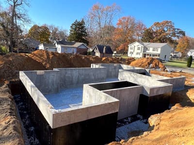Poured concrete foundation walls for a new home build under construction by KRidge Construction