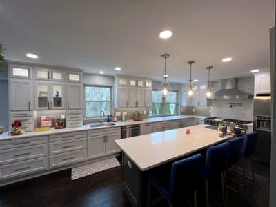 White kitchen renovation with island seating by KRidge Construction